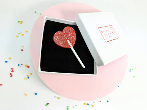 Lollipop heart brooch on acrylic
